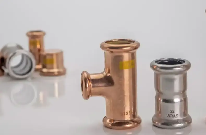 An assortment of copper, stainless steel and carbon steel M-profile press fittings from M-Press.
