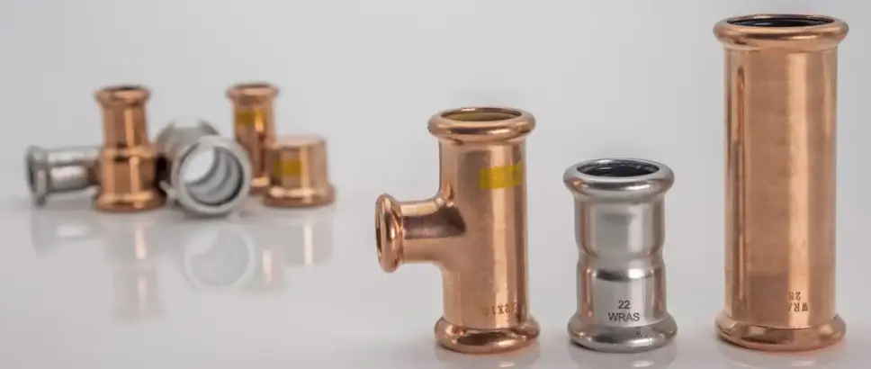 An assortment of copper, stainless steel and carbon steel M-profile press fittings from M-Press.