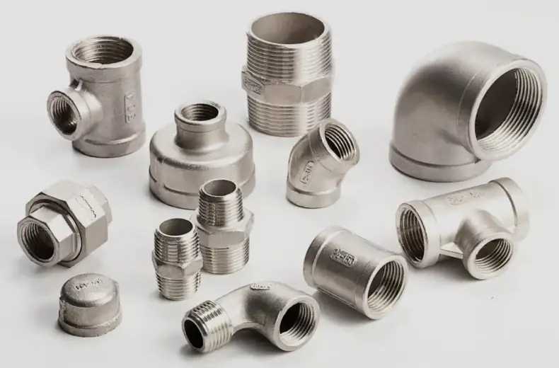 An assortment of ISO 4144 stainless steel BSP threaded pipe fittings.