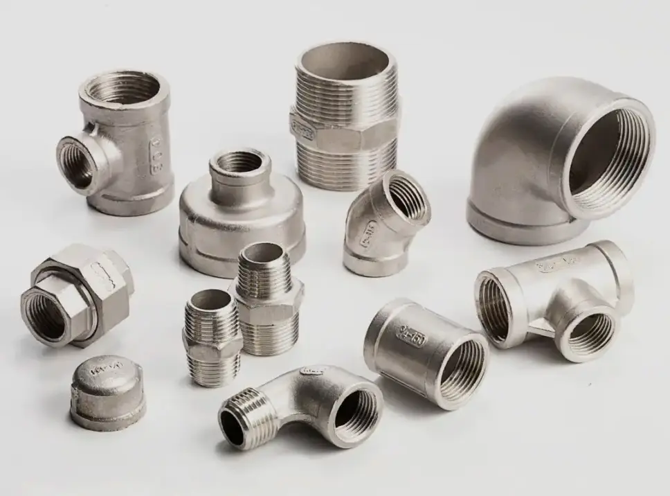 An assortment of ISO 4144 stainless steel BSP threaded pipe fittings.